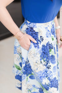 As a major fan of blue, I had to wear this floral skirt and ruffle sleeve blouse. I loved how this Hydragea Bouquet Gatehered A-Line Skirt has a full silhouette but is still flattering. It even has pockets! The fabric is soft and doesn't wrinkle, which is always a huge plus. The skirt {available in size 0-14} pairs perfectly with this Flutter Sleeve Mixed Media Blouse. This vivid top comes in size XS-XL and doesn't wrinkle either. The fabric is perfect for tucking into a skirt without adding bulk at the waistline {which we always love}. This colorful look could easily be dressed up or down. Just add a denim jacket and sandals for an easy yet chic look perfect for spring and summer! If you love gorgeous floral prints like we do, definitely check CeCe's mix and match items featuring the Hydrangea Bouquet print here. The handkerchief blouse is so cute! Here's some of our favorite items. {slider below} Thank you so much for stopping by our blog today. Make sure to check out the whole CeCe collection here plus lots of exclusive styles that are only available at Dillard's. Have a fabulous weekend!